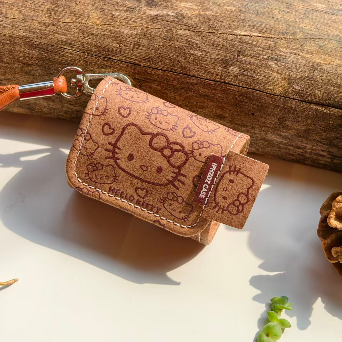 Vintage Brown Hello Kitty Leather AirPods Case with Wristlet Strap | Cute Cartoon Embossed Cover | Compatible with AirPods 1/2/3/Pro | 2026 Trending Kawaii Accessory