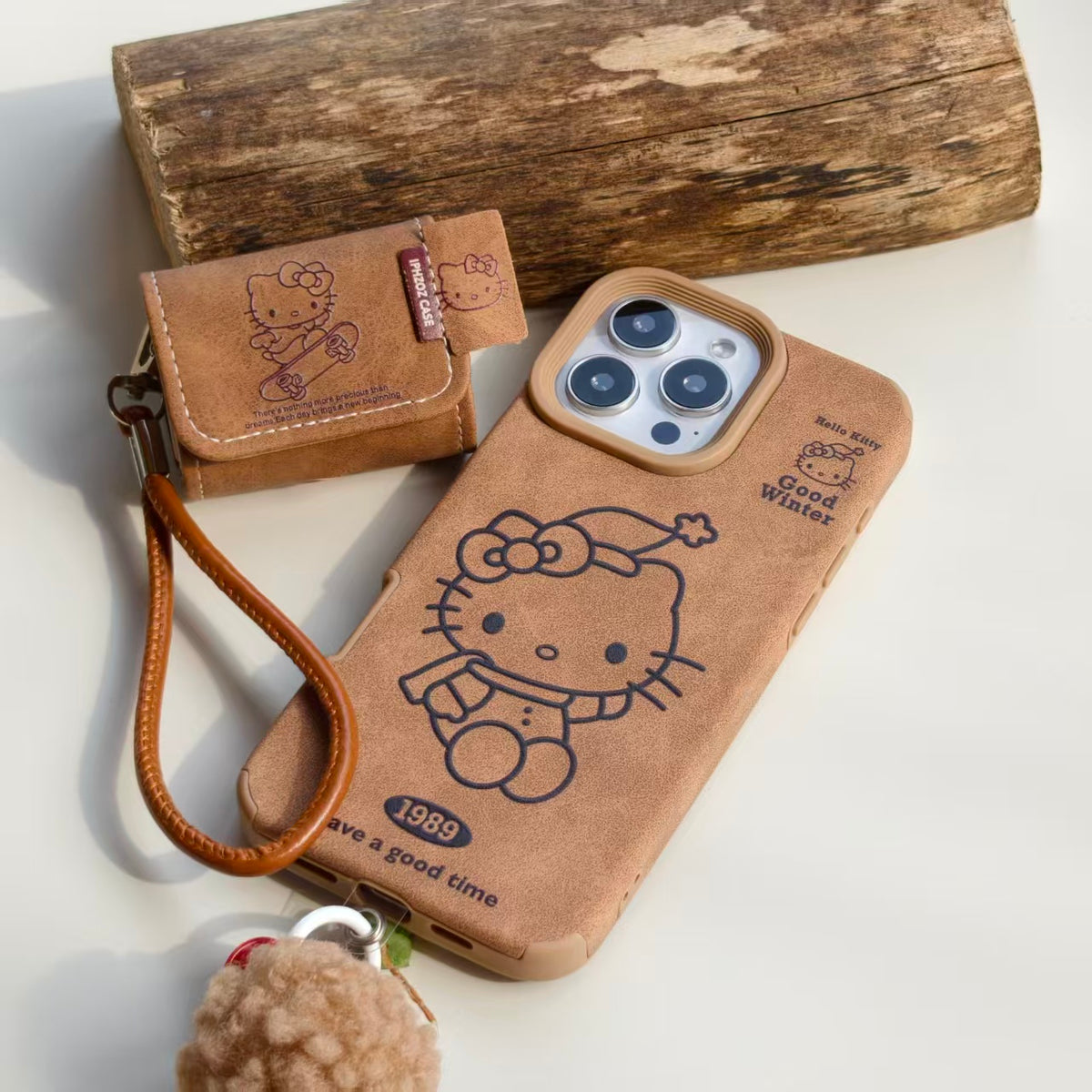Vintage Hello Kitty Leather iPhone Case & AirPods Case Set with Pom Pom Charm | 2026 Trending Retro Kawaii Winter Accessory | Fits iPhone 12-17 Pro Max & AirPods 1/2/3/Pro