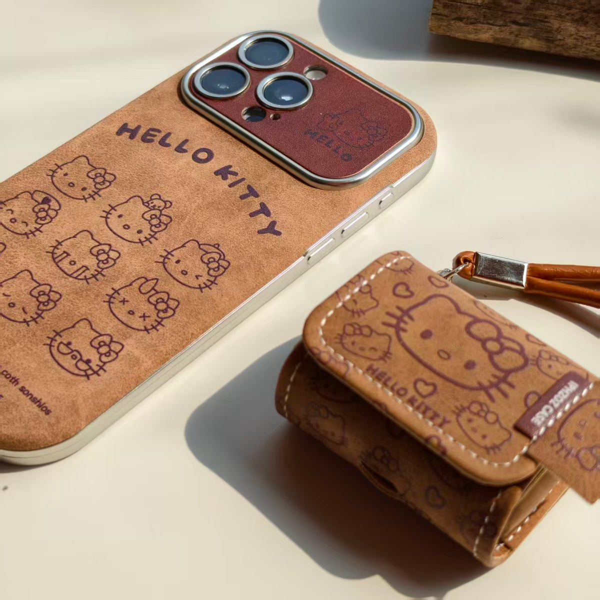 Vintage Hello Kitty Leather iPhone Case & AirPods Case Set | 2026 Trending Retro Kawaii Phone Cover for iPhone 12-17 Pro Max | AirPods 1/2/3/Pro | Brown Leather Wristlet Strap