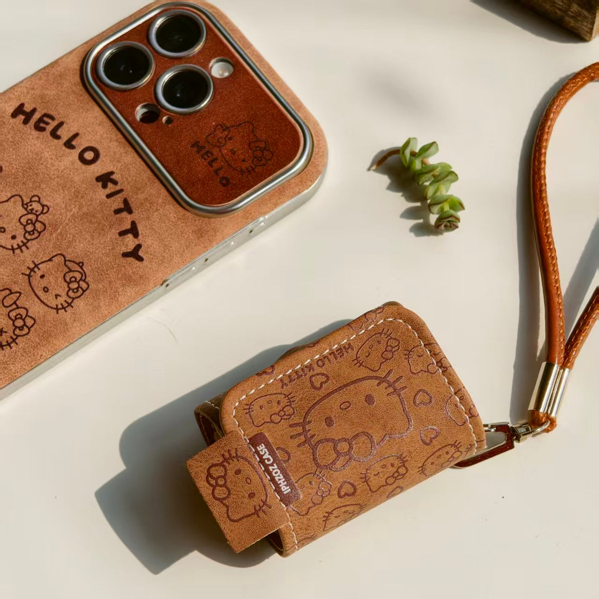 Vintage Hello Kitty Leather iPhone Case & AirPods Case Set | 2026 Trending Retro Kawaii Phone Cover for iPhone 12-17 Pro Max | AirPods 1/2/3/Pro | Brown Leather Wristlet Strap