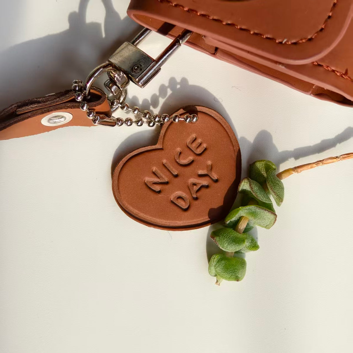 Vintage "NICE DAY" Heart Embossed Leather AirPods Case with Wristlet & Charm | Retro Brown Cover | Compatible with AirPods 1/2/3/Pro | 2026 Trending Aesthetic