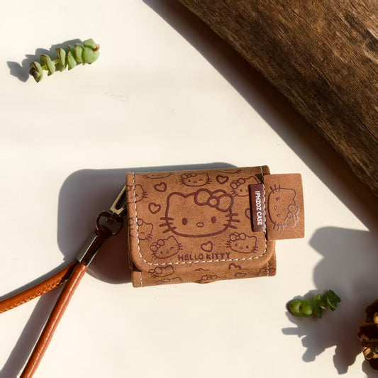 Vintage Brown Hello Kitty Leather AirPods Case with Wristlet Strap | Cute Cartoon Embossed Cover | Compatible with AirPods 1/2/3/Pro | 2026 Trending Kawaii Accessory
