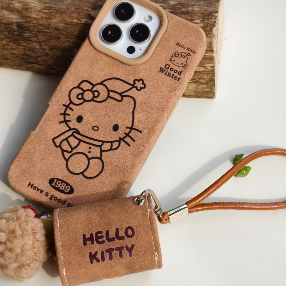Vintage Hello Kitty Leather iPhone Case & AirPods Case Set with Pom Pom Charm | 2026 Trending Retro Kawaii Winter Accessory | Fits iPhone 12-17 Pro Max & AirPods 1/2/3/Pro