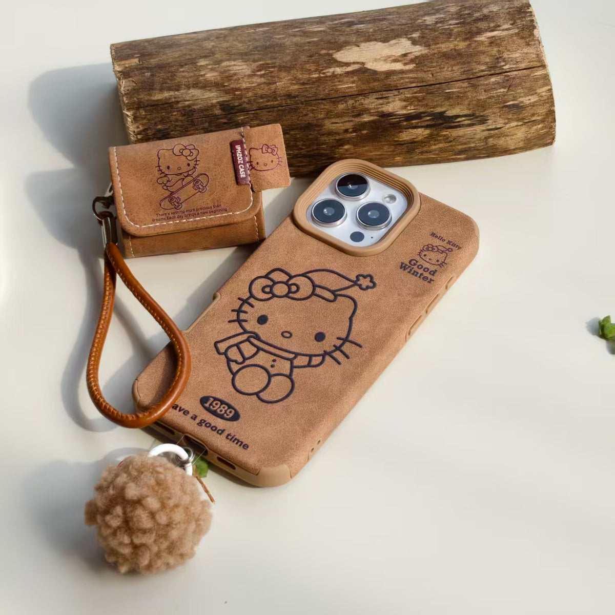 Vintage Hello Kitty Leather iPhone Case & AirPods Case Set with Pom Pom Charm | 2026 Trending Retro Kawaii Winter Accessory | Fits iPhone 12-17 Pro Max & AirPods 1/2/3/Pro