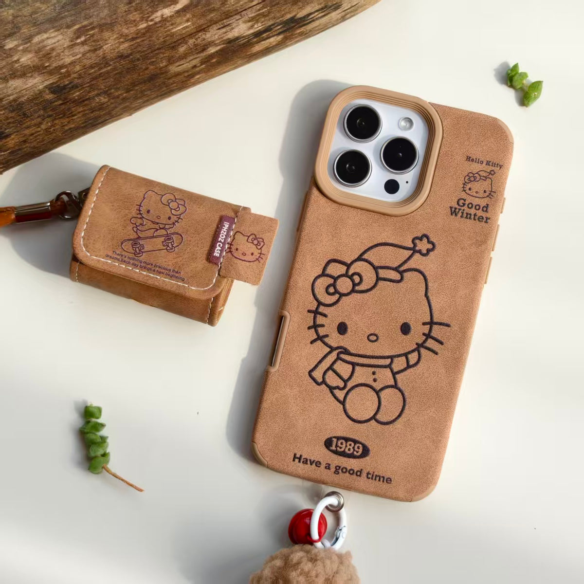 Vintage Hello Kitty Leather iPhone Case & AirPods Case Set with Pom Pom Charm | 2026 Trending Retro Kawaii Winter Accessory | Fits iPhone 12-17 Pro Max & AirPods 1/2/3/Pro