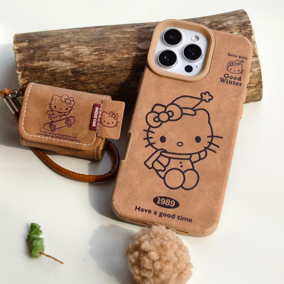 Vintage Hello Kitty Leather iPhone Case & AirPods Case Set with Pom Pom Charm | 2026 Trending Retro Kawaii Winter Accessory | Fits iPhone 12-17 Pro Max & AirPods 1/2/3/Pro