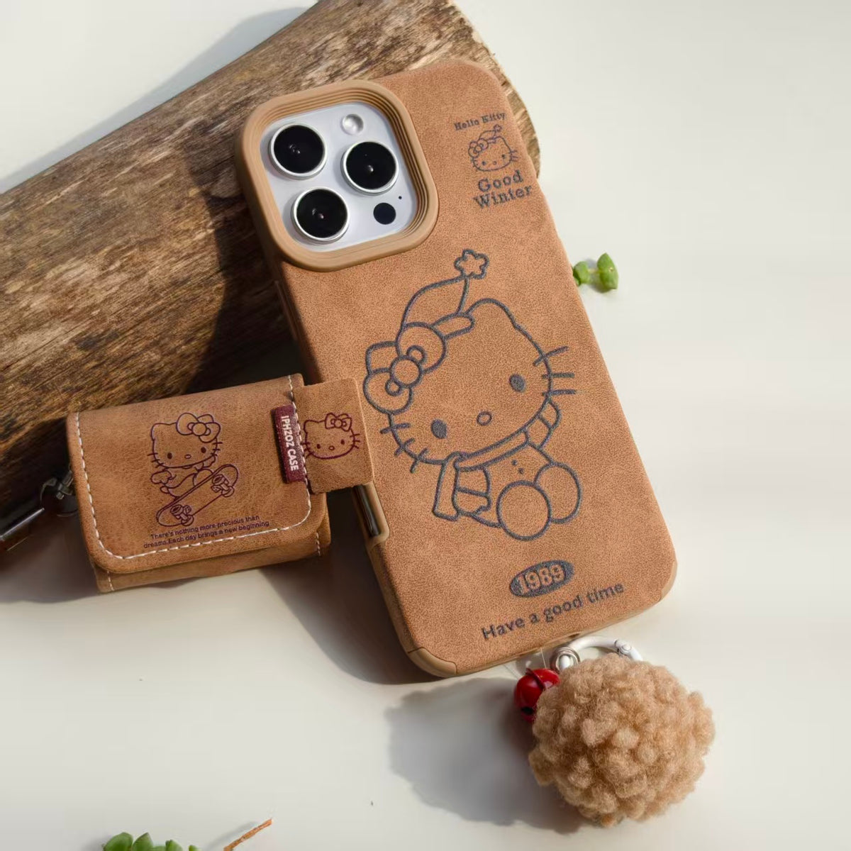 Vintage Hello Kitty Leather iPhone Case & AirPods Case Set with Pom Pom Charm | 2026 Trending Retro Kawaii Winter Accessory | Fits iPhone 12-17 Pro Max & AirPods 1/2/3/Pro