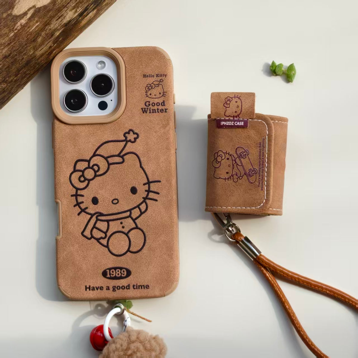 Vintage Hello Kitty Leather iPhone Case & AirPods Case Set with Pom Pom Charm | 2026 Trending Retro Kawaii Winter Accessory | Fits iPhone 12-17 Pro Max & AirPods 1/2/3/Pro