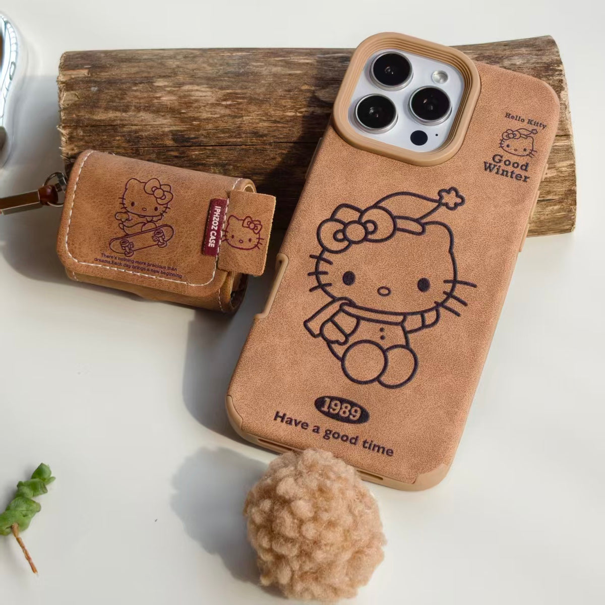 Vintage Hello Kitty Leather iPhone Case & AirPods Case Set with Pom Pom Charm | 2026 Trending Retro Kawaii Winter Accessory | Fits iPhone 12-17 Pro Max & AirPods 1/2/3/Pro